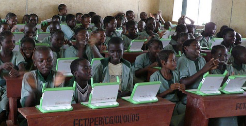 A group of students in a classroom each with a green laptop.

One Laptop per Child, Nigeria. CC-BY.
https://www.flickr.com/photos/olpc/3079783249/