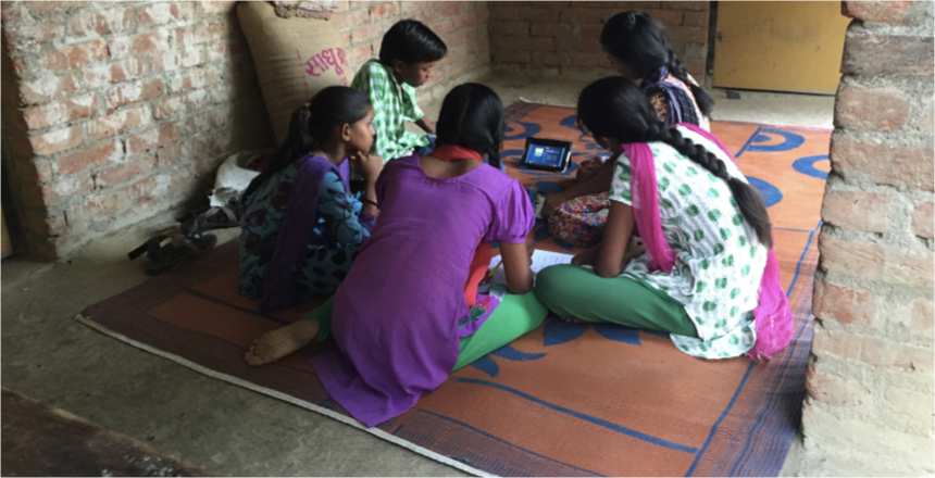 A group of girls sitting on a rug around a small screen

Children accessing technology at home, an image representative of the era of the pandemic. Photo source: https://gbc-education.org/gep-report-release.